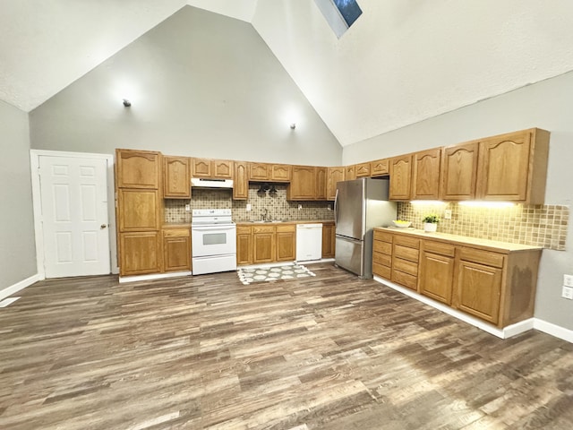 187 Sinnette, Greenup, KY 41144 - kitchen featuring white appliances, dark wood-style flooring, high vaulted ceiling, and under cabinet range hood