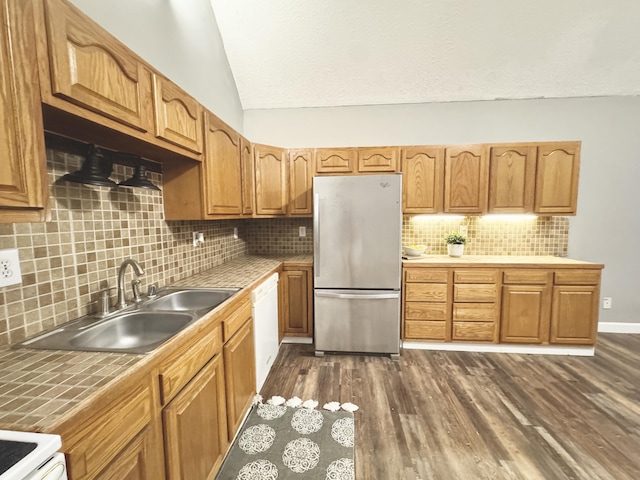 187 Sinnette, Greenup, KY 41144 - kitchen with decorative backsplash, white appliances, tile counters, a sink, and vaulted ceiling