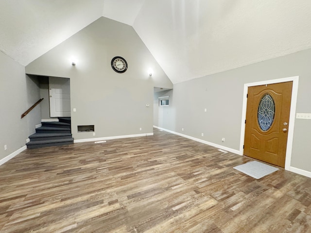 187 Sinnette, Greenup, KY 41144 - unfurnished living room with stairway, baseboards, wood finished floors, and lofted ceiling
