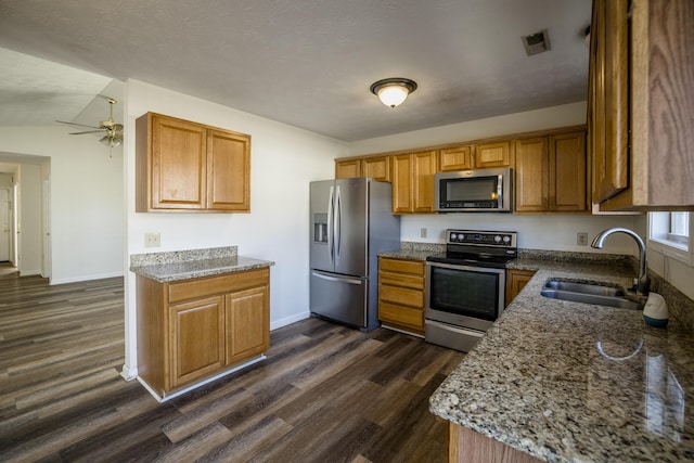 108 Sturbridge Ln, Winchester, KY 40391 - kitchen with appliances with stainless steel finishes, a sink, brown cabinets, and dark wood-type flooring