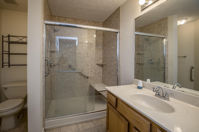 108 Sturbridge Ln, Winchester, KY 40391 - bathroom with toilet, vanity, a shower stall, a textured ceiling, and tile patterned flooring