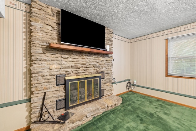 140 Adams Ln, Richmond, KY 40475 - carpeted living room featuring a stone fireplace, baseboards, and a textured ceiling