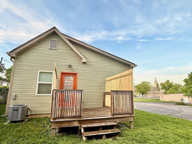 310 W Chestnut St, Nicholasville, KY 40356 - back of property with cooling unit, a wooden deck, and a yard