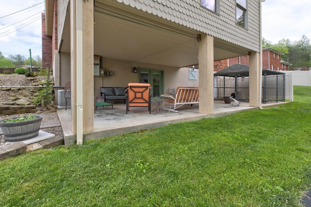 view of patio with fence, a gazebo, an outdoor living space, and central AC unit