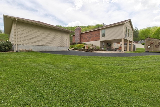 view of property exterior featuring a lawn