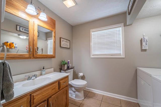 605 Coleman Dr, Berea, KY 40403 - bathroom featuring washer and dryer, toilet, baseboards, tile patterned flooring, and vanity