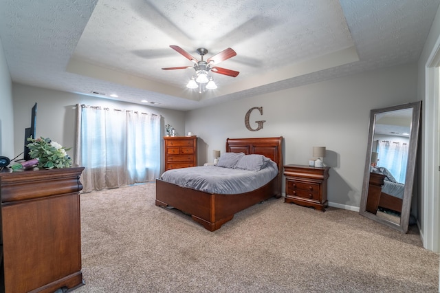 605 Coleman Dr, Berea, KY 40403 - bedroom with a tray ceiling, a textured ceiling, carpet flooring, and a ceiling fan