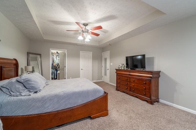 605 Coleman Dr, Berea, KY 40403 - carpeted bedroom featuring a raised ceiling, a textured ceiling, baseboards, and a ceiling fan