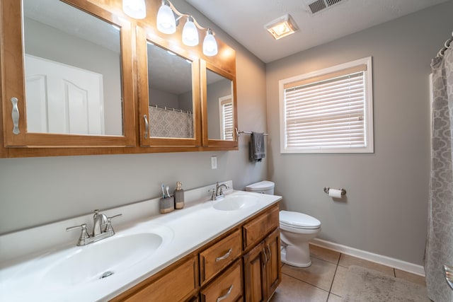 605 Coleman Dr, Berea, KY 40403 - bathroom featuring toilet, tile patterned floors, visible vents, and a sink