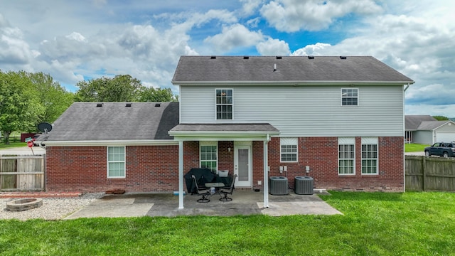 605 Coleman Dr, Berea, KY 40403 - back of property with a patio, cooling unit, a fenced backyard, a yard, and brick siding