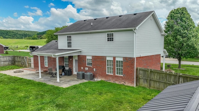 605 Coleman Dr, Berea, KY 40403 - rear view of house with a patio area, brick siding, a yard, a fenced backyard, and central AC unit