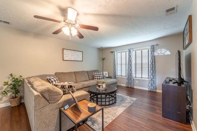 605 Coleman Dr, Berea, KY 40403 - living area with a textured ceiling, baseboards, visible vents, and wood finished floors