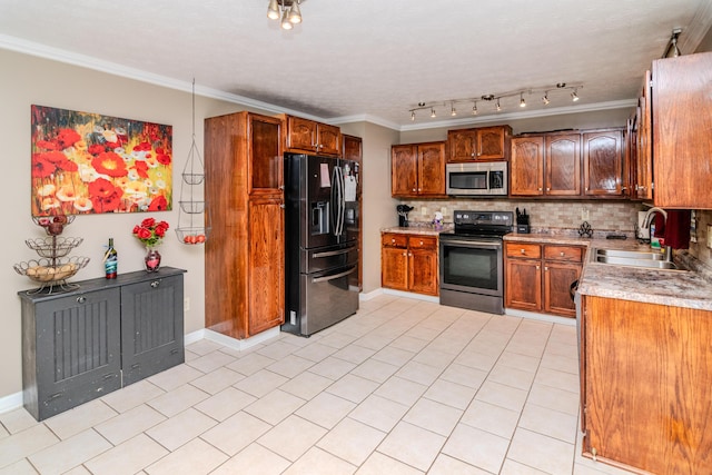 kitchen featuring a sink, decorative backsplash, crown molding, and stainless steel appliances