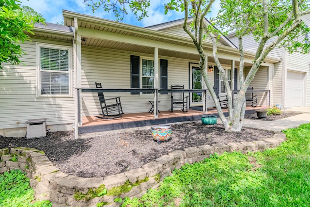 view of front of house featuring a porch and a garage