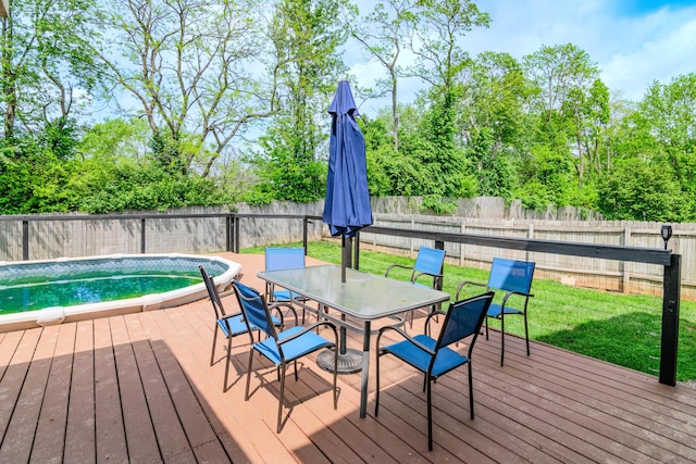 wooden terrace with a lawn, a fenced in pool, a fenced backyard, and outdoor dining space