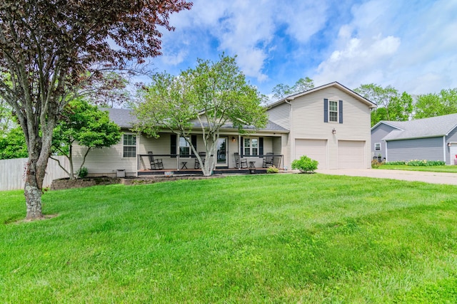 view of front of home featuring a porch, a garage, a front lawn, and driveway