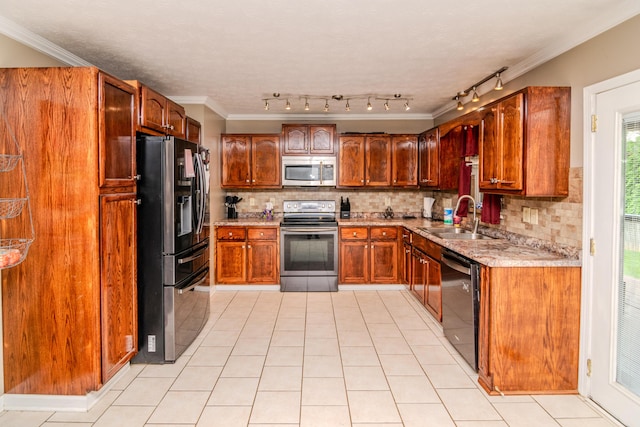 kitchen featuring a sink, light tile patterned floors, tasteful backsplash, and stainless steel appliances
