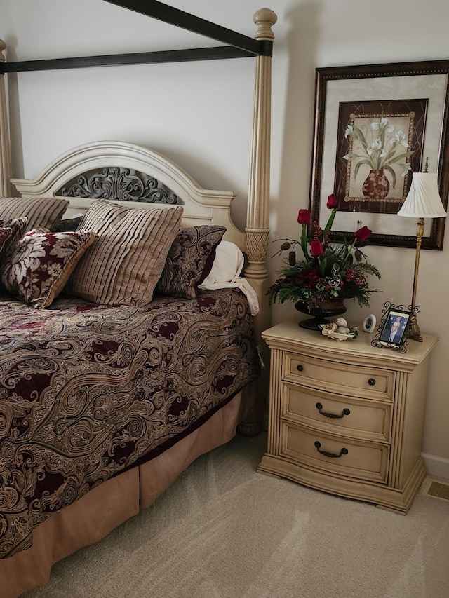 bedroom featuring light carpet