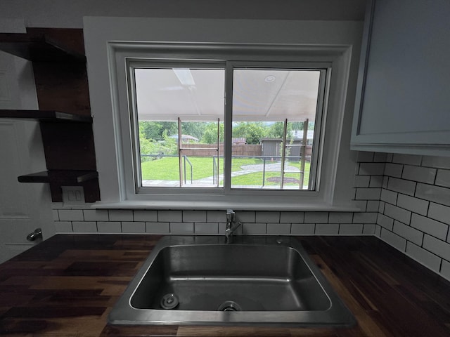 422 Wilderness Rd, Middlesboro, KY 40965 - kitchen view of a sink and backsplash