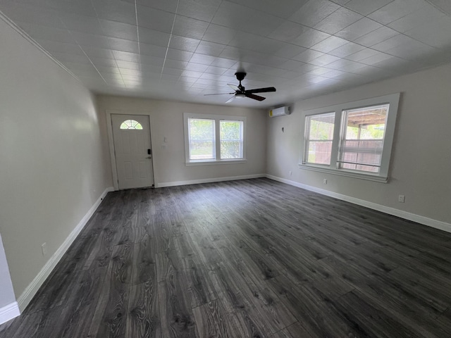 422 Wilderness Rd, Middlesboro, KY 40965 - entryway with an AC wall unit, dark wood-type flooring, a ceiling fan, and baseboards