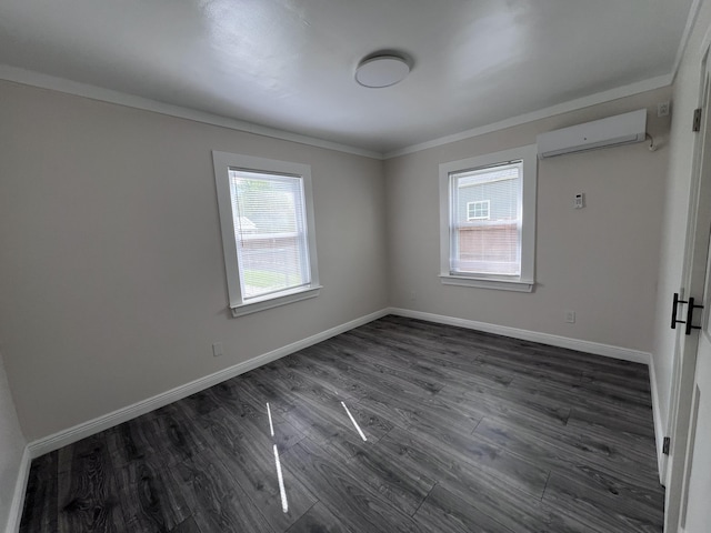 422 Wilderness Rd, Middlesboro, KY 40965 - spare room featuring a wall mounted air conditioner, dark wood-style flooring, ornamental molding, and baseboards