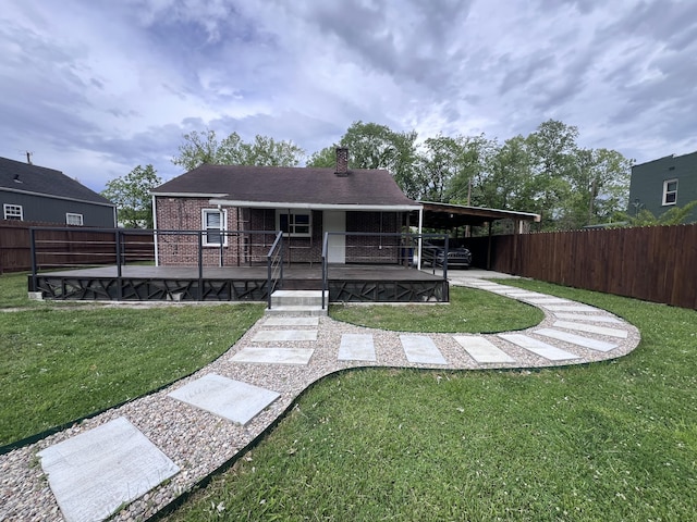 422 Wilderness Rd, Middlesboro, KY 40965 - view of front of house with a chimney and brick siding