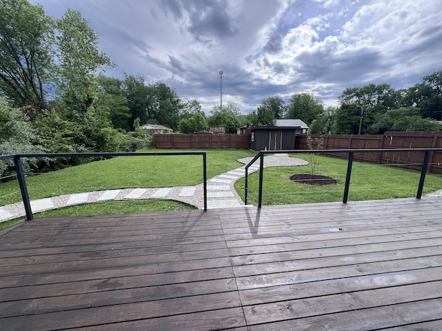 422 Wilderness Rd, Middlesboro, KY 40965 - deck featuring a storage unit and an outbuilding