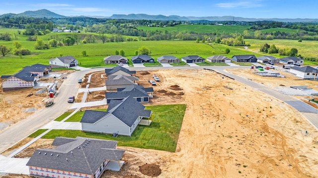 birds eye view of property featuring a mountain view and a residential view