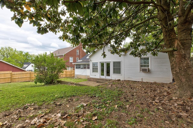 back of house with cooling unit and a patio