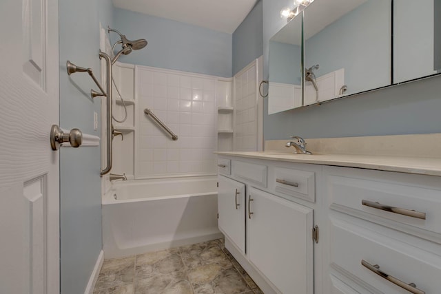 full bathroom with vanity, shower / tub combination, and baseboards