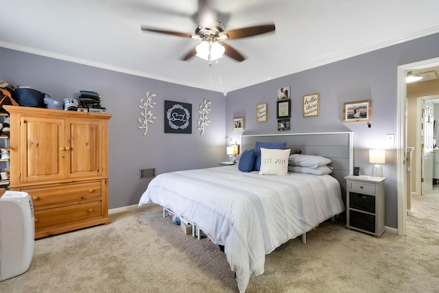 bedroom with light colored carpet, crown molding, baseboards, and a ceiling fan
