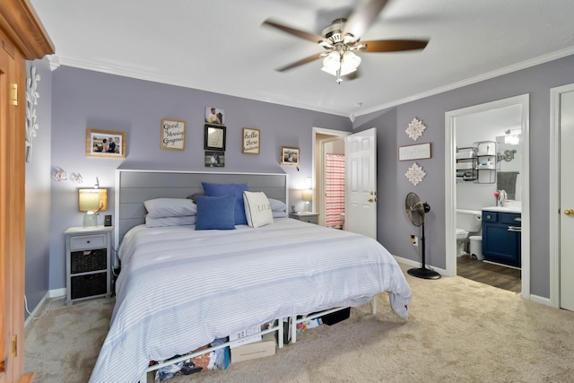 carpeted bedroom featuring ornamental molding, baseboards, a ceiling fan, and connected bathroom