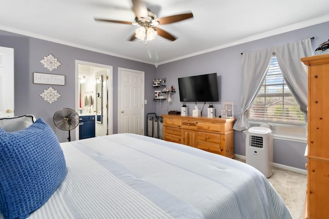 bedroom with carpet flooring, baseboards, a ceiling fan, ornamental molding, and ensuite bathroom