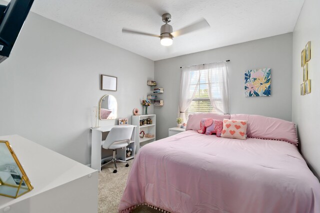 carpeted bedroom with a ceiling fan