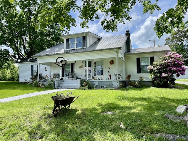 130 Branch Rd, Monticello, KY 42633 - view of front of house with a porch, a front lawn, a chimney, and metal roof
