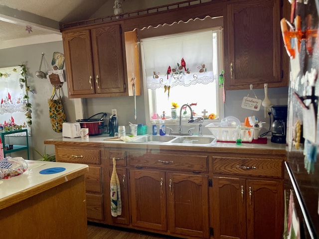 130 Branch Rd, Monticello, KY 42633 - kitchen featuring light countertops, brown cabinetry, and a sink
