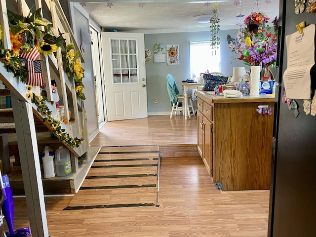 130 Branch Rd, Monticello, KY 42633 - entryway with a textured ceiling, baseboards, stairway, and light wood-style floors