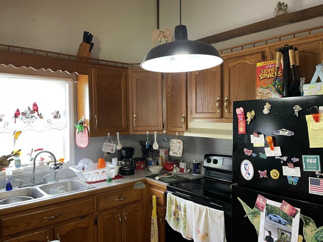 130 Branch Rd, Monticello, KY 42633 - kitchen featuring a sink, stainless steel range with electric stovetop, light countertops, freestanding refrigerator, and under cabinet range hood
