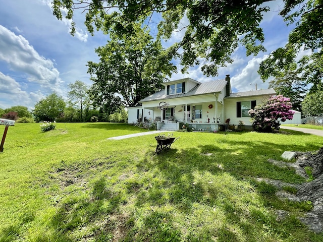 130 Branch Rd, Monticello, KY 42633 - view of front of home with a front lawn, covered porch, and metal roof