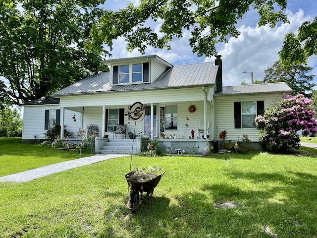 130 Branch Rd, Monticello, KY 42633 - view of front of property featuring a front lawn, covered porch, a chimney, and metal roof