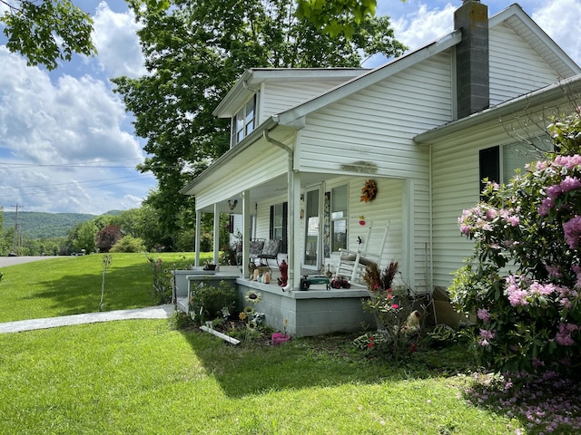 130 Branch Rd, Monticello, KY 42633 - back of property featuring a porch, a yard, and a chimney