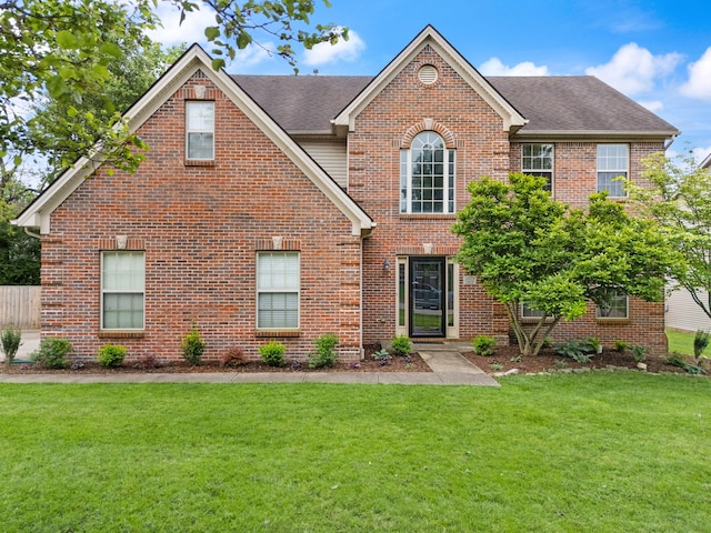 5029 Magnolia Gardens Pl, Lexington, KY 40515 - view of front of home featuring a front lawn, brick siding, and a shingled roof