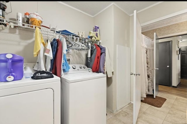 2745 Farris Branch Rd, Wallingford, KY 41093 - laundry room featuring separate washer and dryer, ornamental molding, and light tile patterned floors