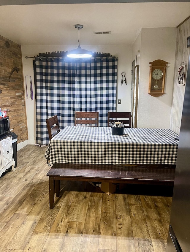 bedroom featuring wood finished floors and baseboards