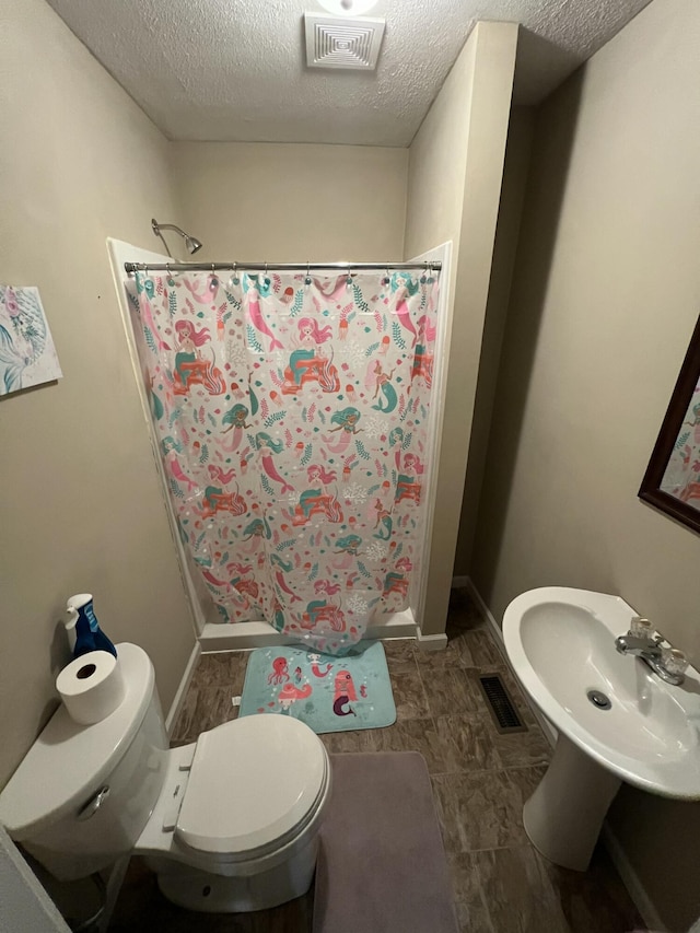 bathroom featuring visible vents and curtained shower