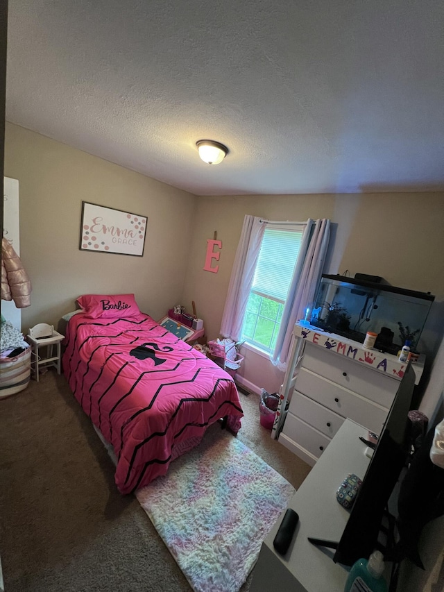 carpeted bedroom with a textured ceiling