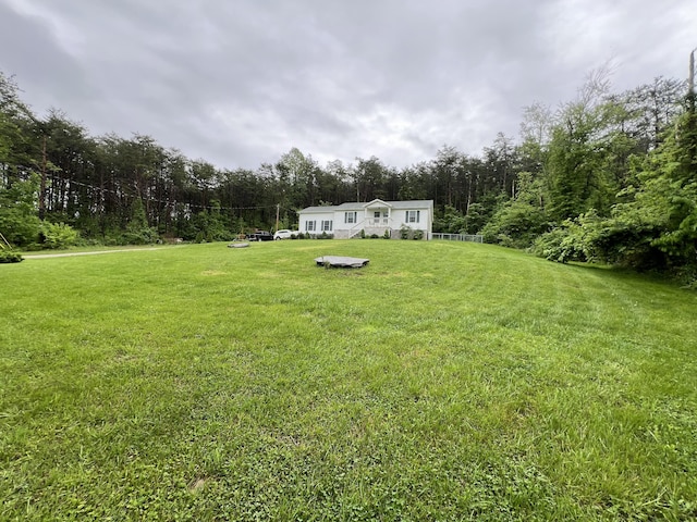 view of yard featuring a view of trees