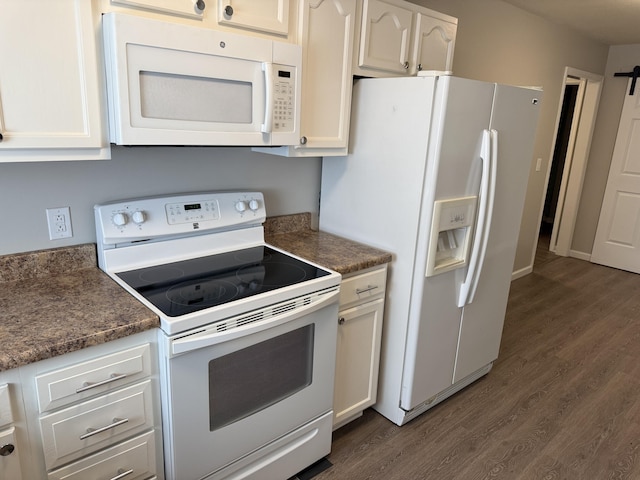 kitchen featuring white appliances, dark wood-style flooring, and white cabinetry