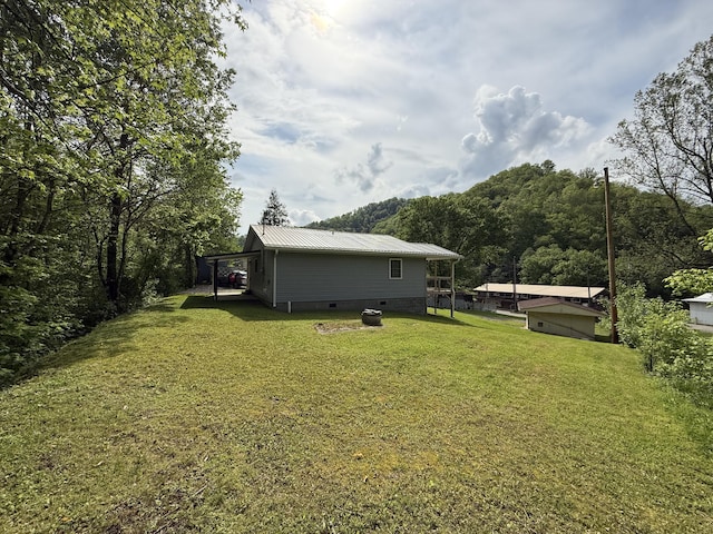 view of yard with a view of trees