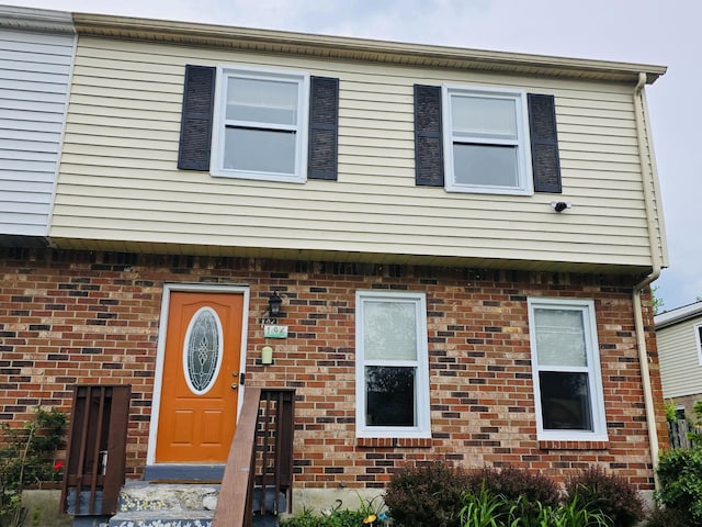 view of property with brick siding